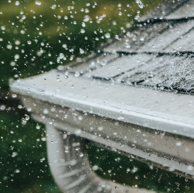 rain falling on gutter guards