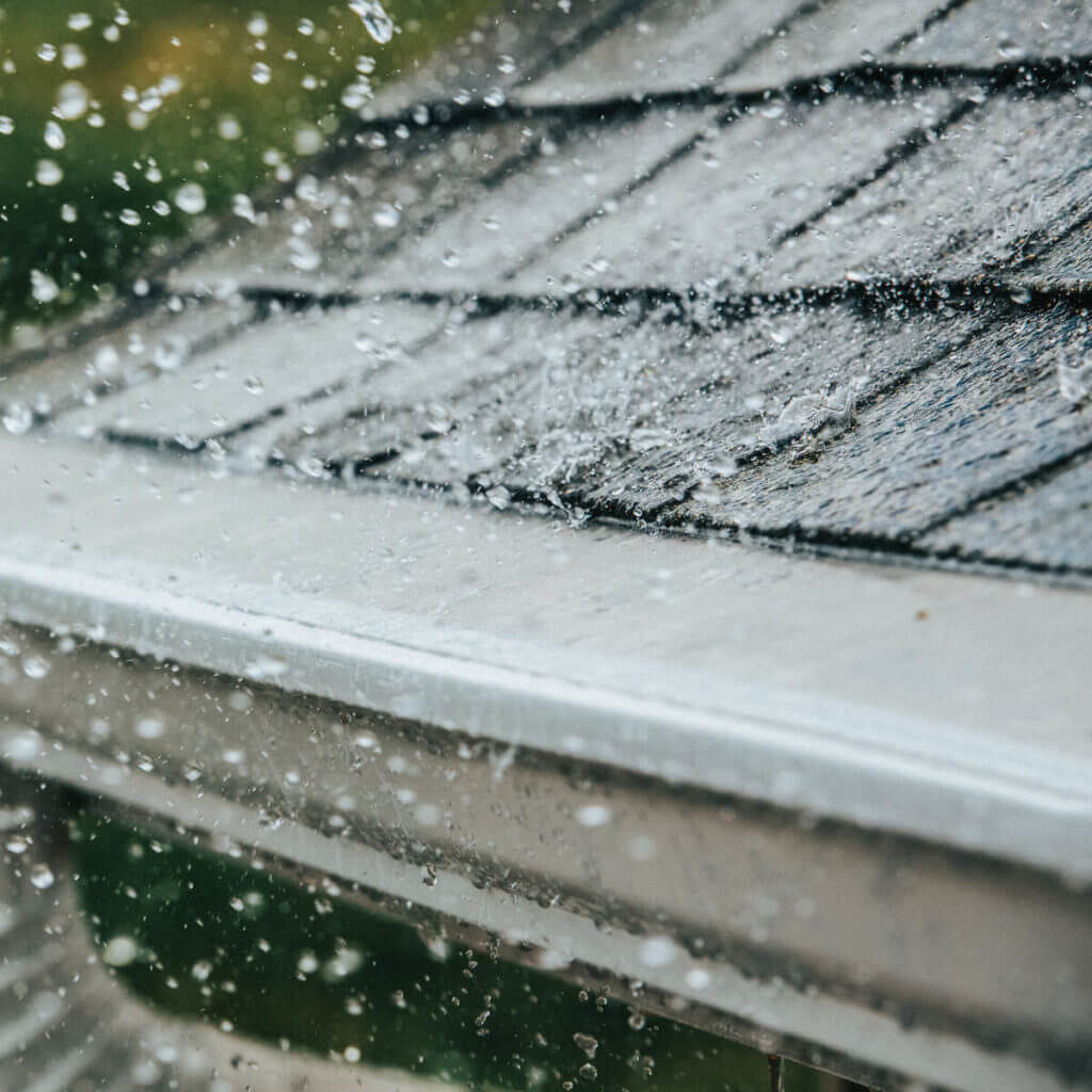 Raining On Gutter Guards Blocking Debris